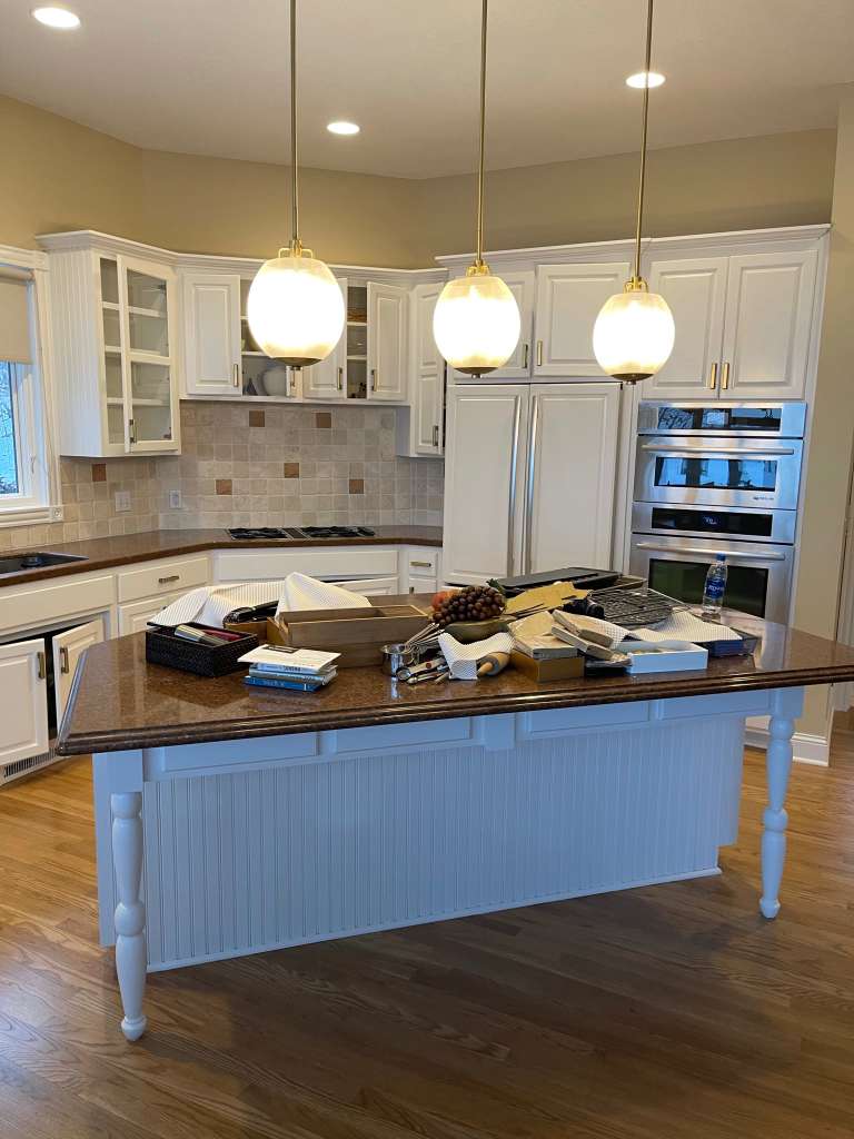 White kitchen cabinets and island after painting